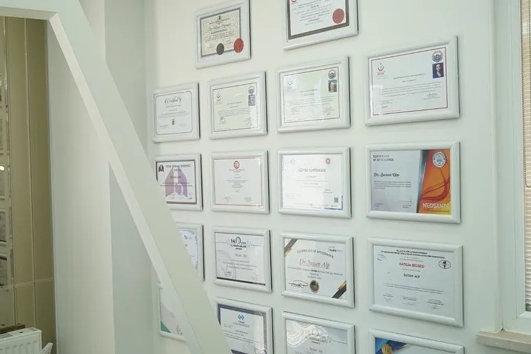 The wall at the practice where the certificates hang